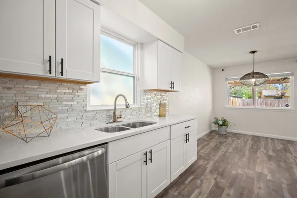 a kitchen with sink and window
