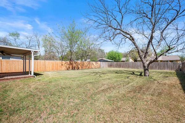 a view of backyard with green space