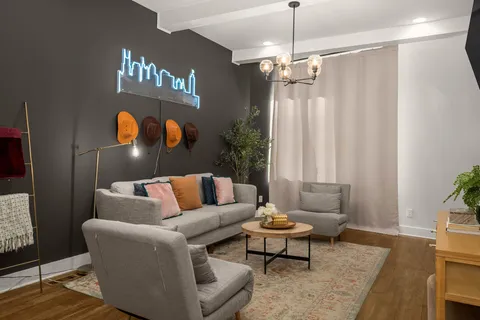 a living room with furniture and a flat screen tv