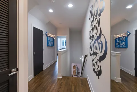 a bedroom with a bed and a television