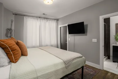 a bathroom with a mirror and a shower curtain