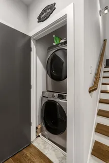 a bedroom with a bed and a mirror