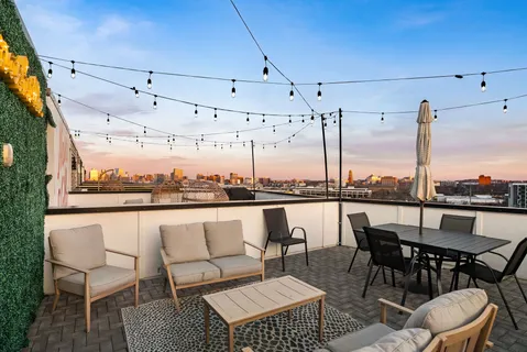a view of a terrace with furniture