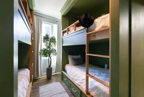 a bedroom with a bed and a mirror