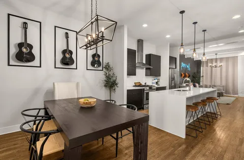 a kitchen with stainless steel appliances a refrigerator sink and stove