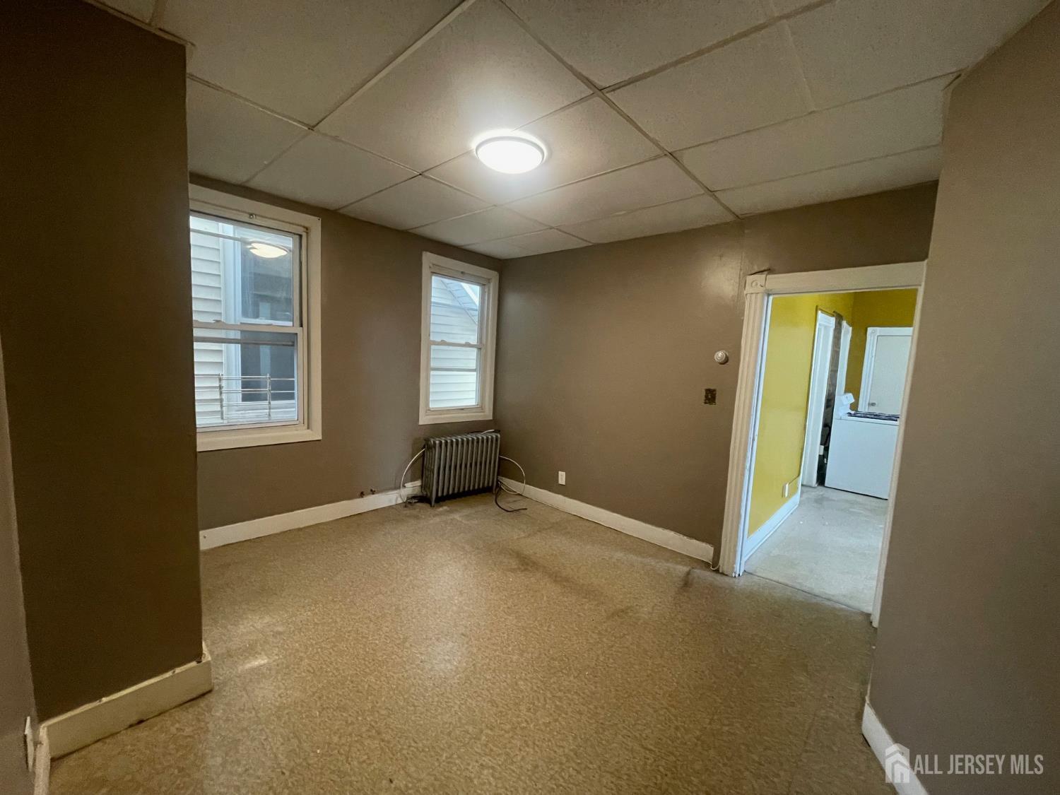 385 Washington Street Perth Amboy, NJ 08861 - Photo 11 of 13 an empty room with windows