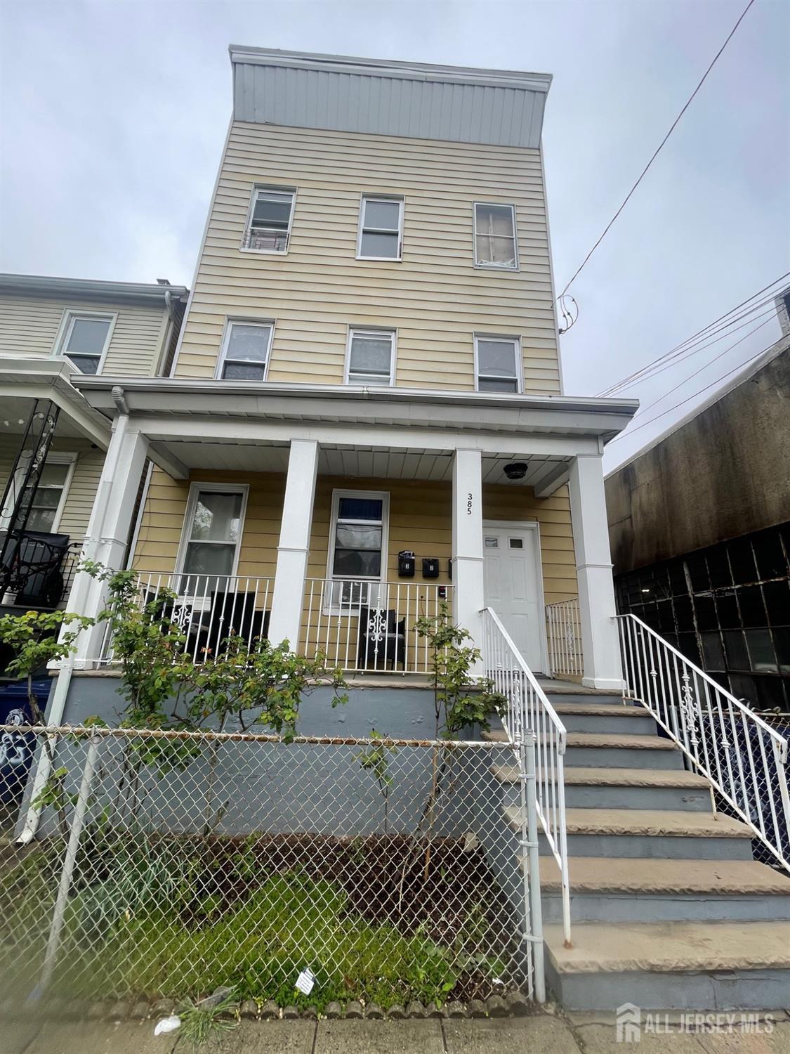 385 Washington Street Perth Amboy, NJ 08861 - Photo 2 of 13 front view of a house