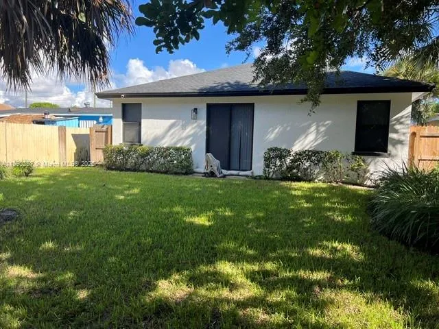 a view of a house with a garden