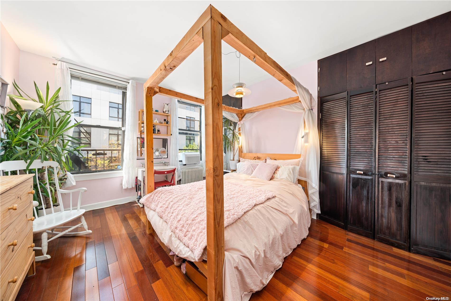 151 Eagle Street, Unit 3 Brooklyn, NY 11222 - Photo 8 of 11 a bedroom with a bed and a large window