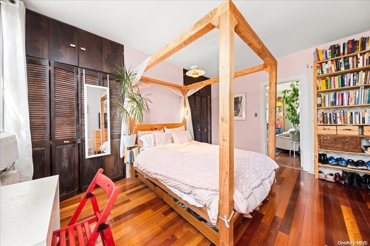 151 Eagle Street, Unit 3 Brooklyn, NY 11222 - Photo 10 of 11 a bed room with a bed and a book shelf