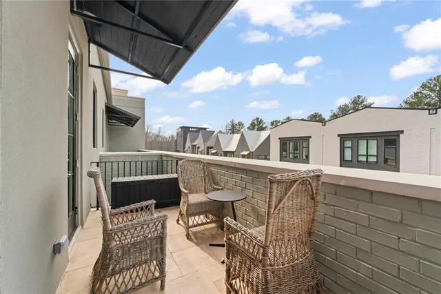 a view of balcony with furniture