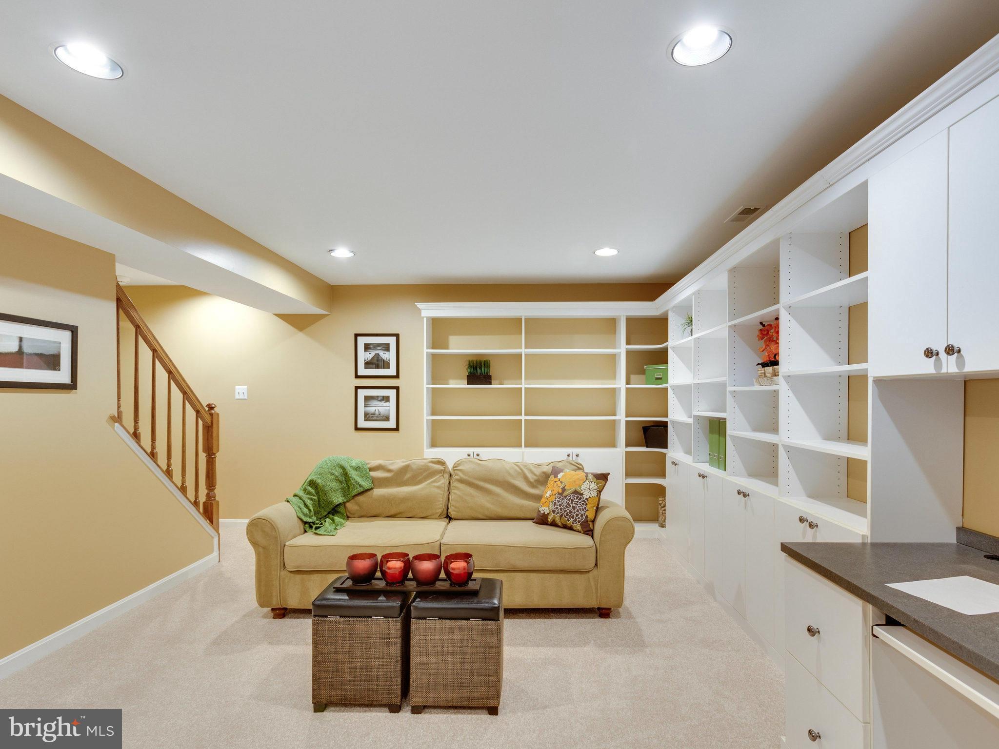 6564 Forsythia Street Springfield, VA 22150 - Photo 27 of 30 a living room with furniture and a flat screen tv