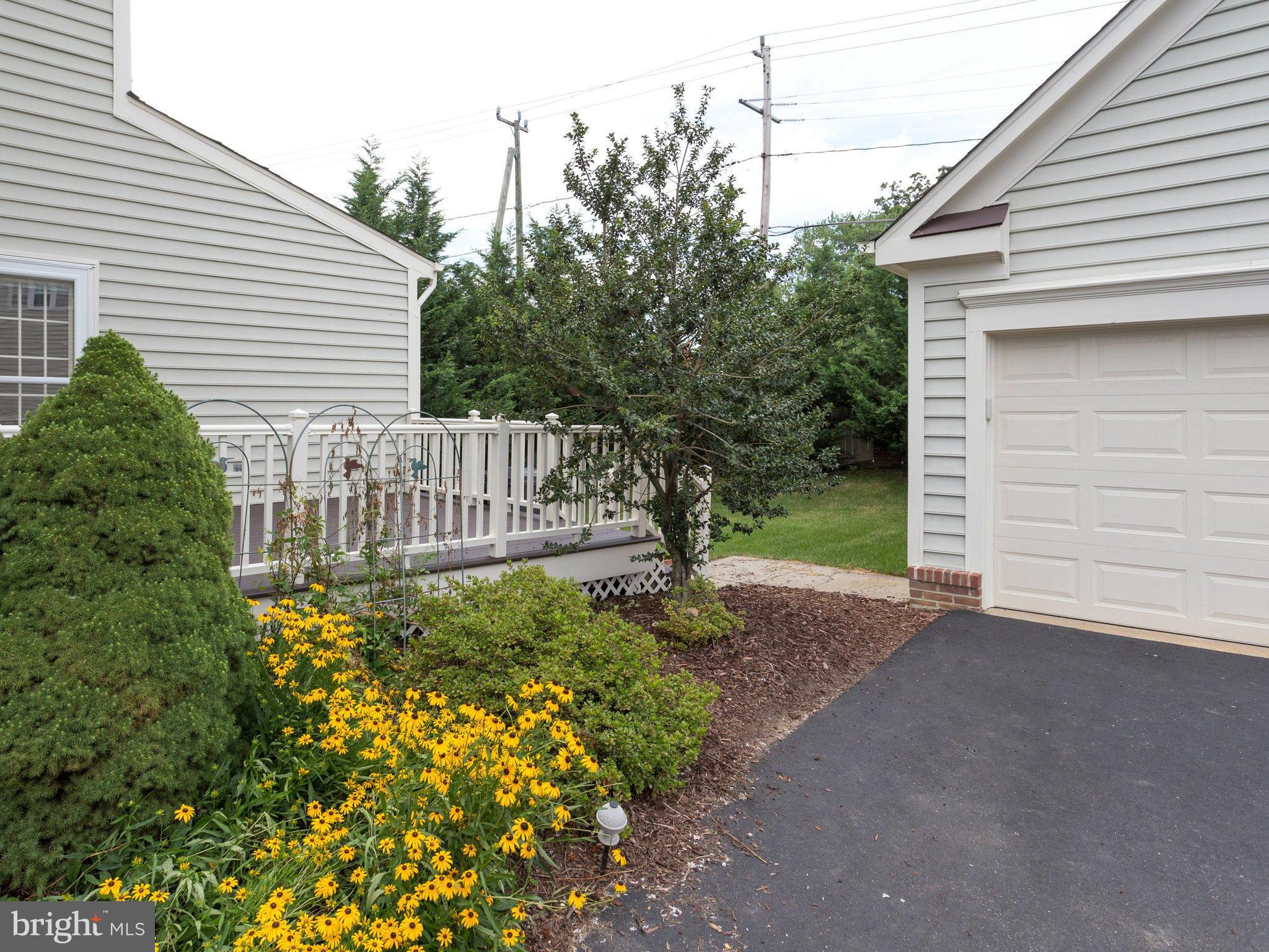 6564 Forsythia Street Springfield, VA 22150 - Photo 5 of 30 a view of a house with a yard and pathway