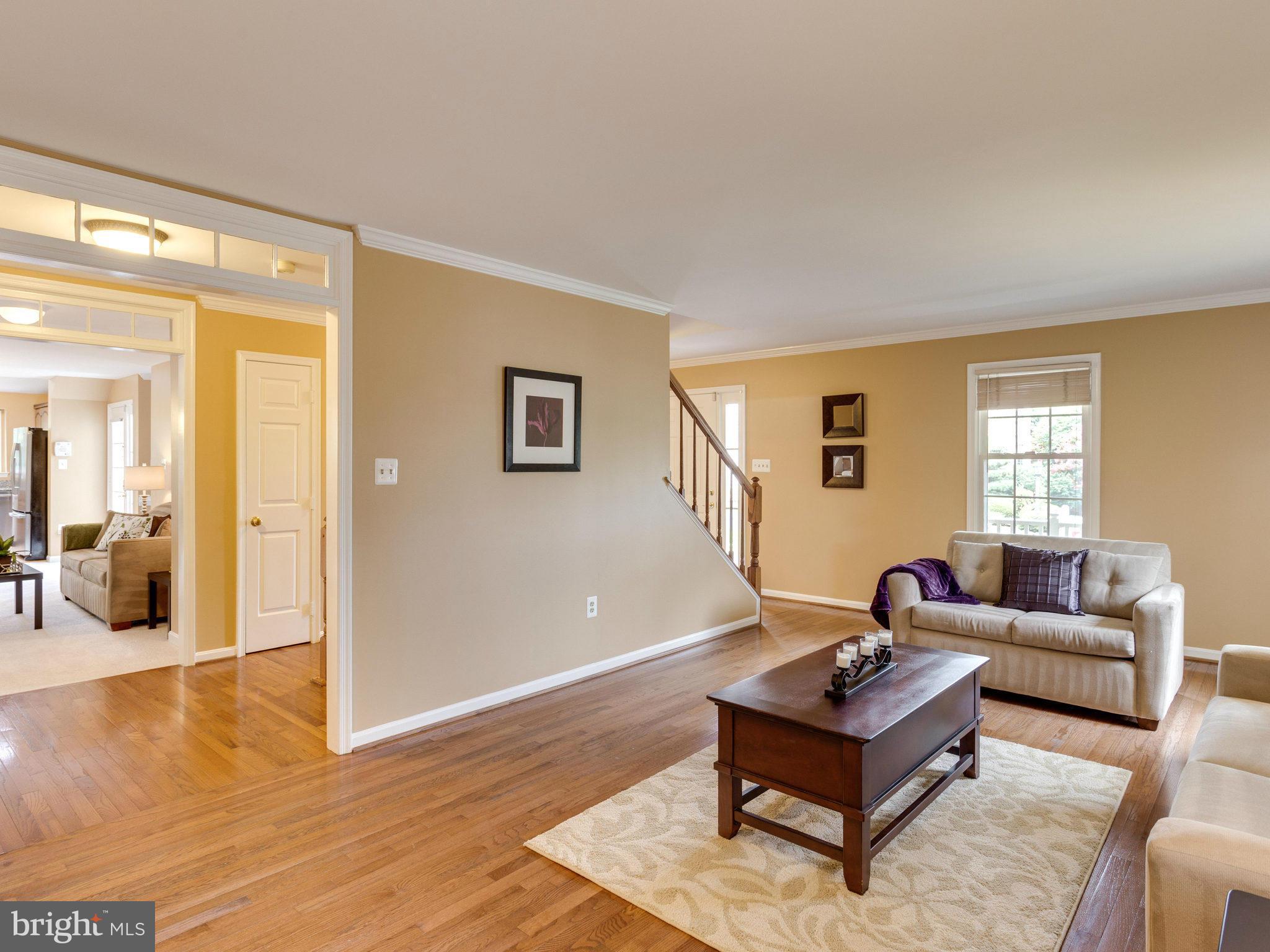 6564 Forsythia Street Springfield, VA 22150 - Photo 8 of 30 a living room with furniture and a window