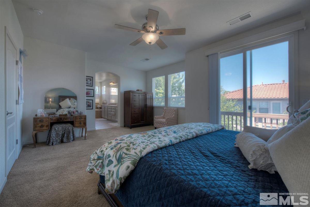 431 Shire Court Reno, NV 89521 - Photo 13 of 40 a bed sitting in a bedroom next to a window