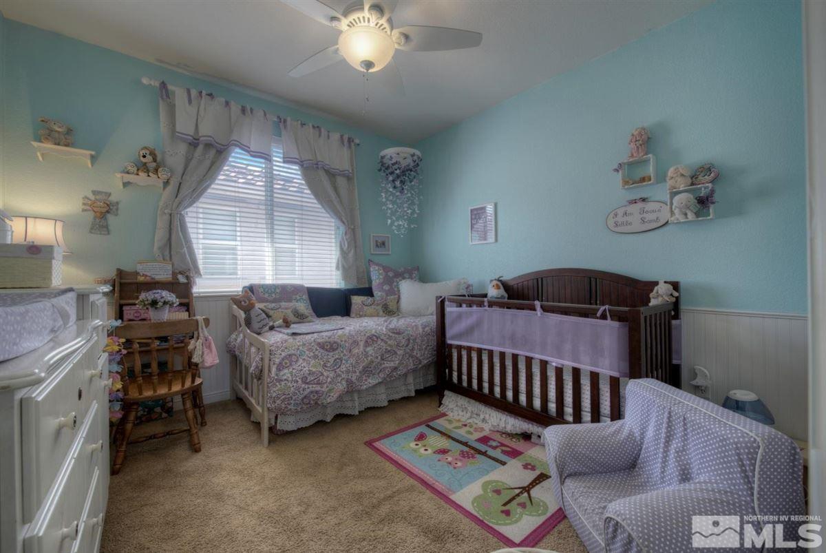 431 Shire Court Reno, NV 89521 - Photo 19 of 40 a bedroom with furniture and a wooden floor