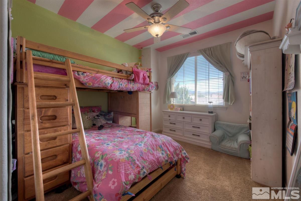 431 Shire Court Reno, NV 89521 - Photo 20 of 40 a bedroom with a bed and a window