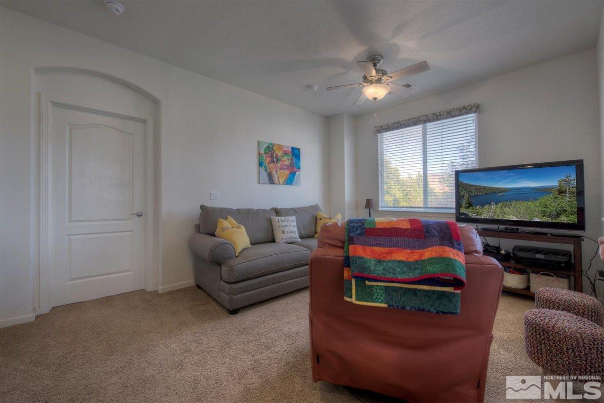 431 Shire Court Reno, NV 89521 - Photo 23 of 40 a living room with furniture and a flat screen tv