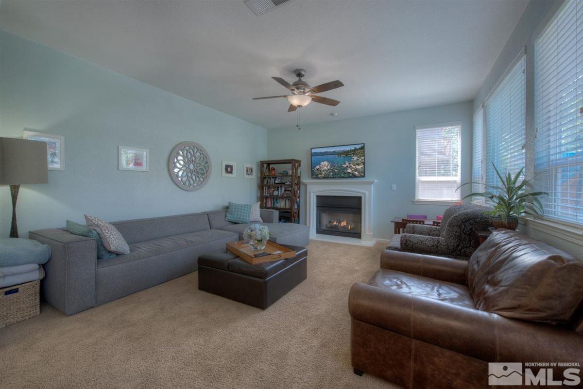 431 Shire Court Reno, NV 89521 - Photo 8 of 40 a living room with furniture a fireplace and a window