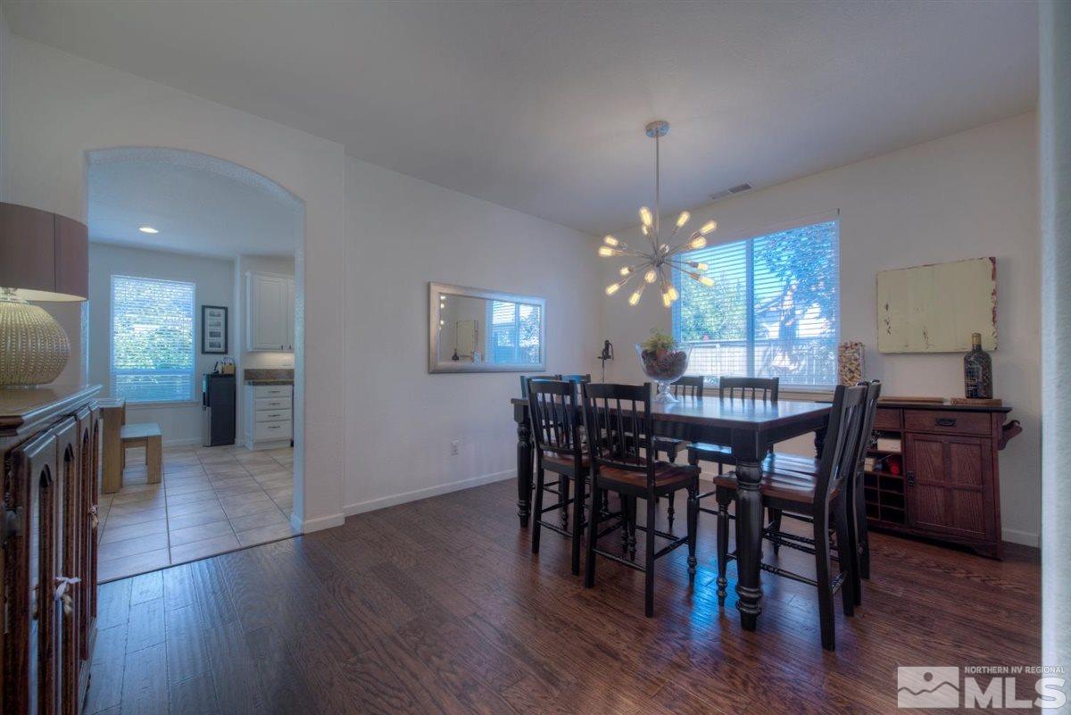 431 Shire Court Reno, NV 89521 - Photo 10 of 40 a view of a dining room with furniture and wooden floor