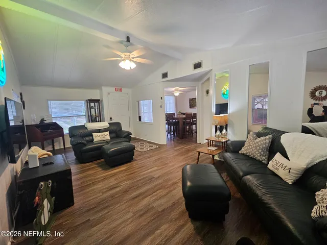 a room with furniture and a flat screen tv