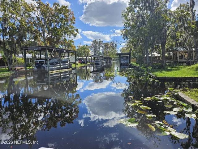 a view of a water fountain in front of a house
