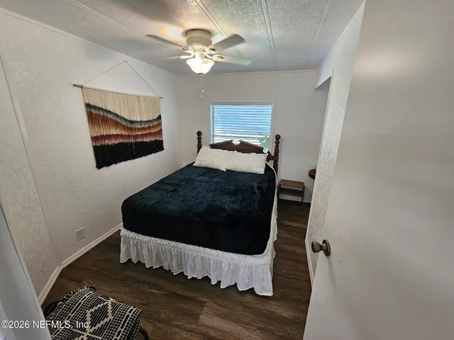 a bed room with double bed and a lamp