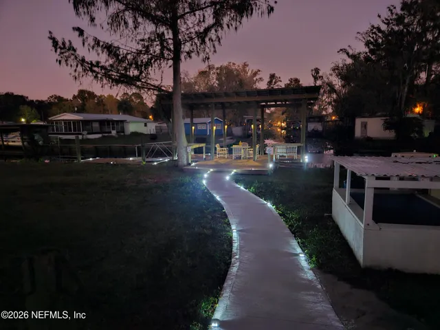 a view of a house with a big yard