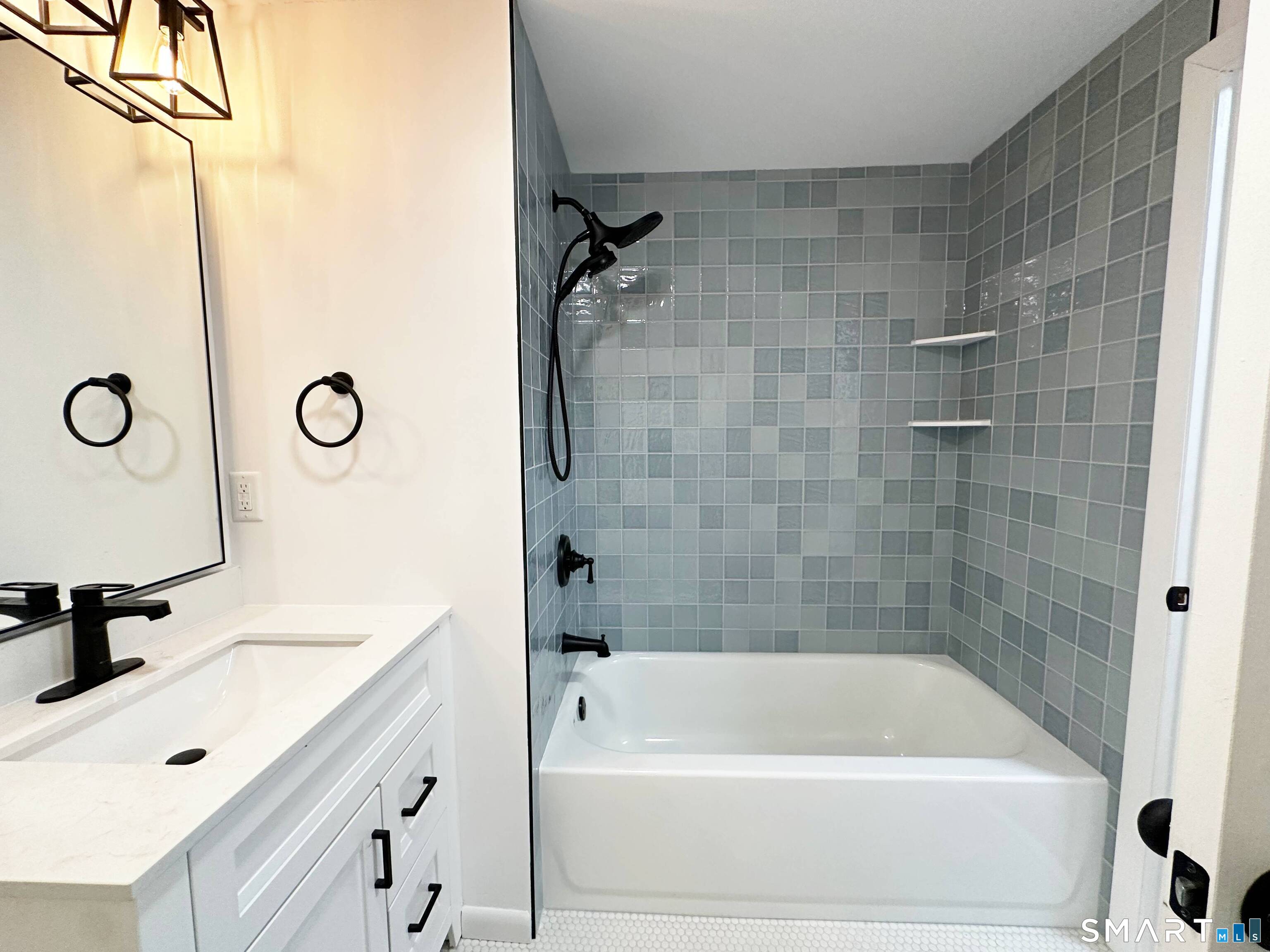 148 Hyde Road West Hartford, CT 06117 - Photo 13 of 24 a bathroom with a tub a sink and a shower