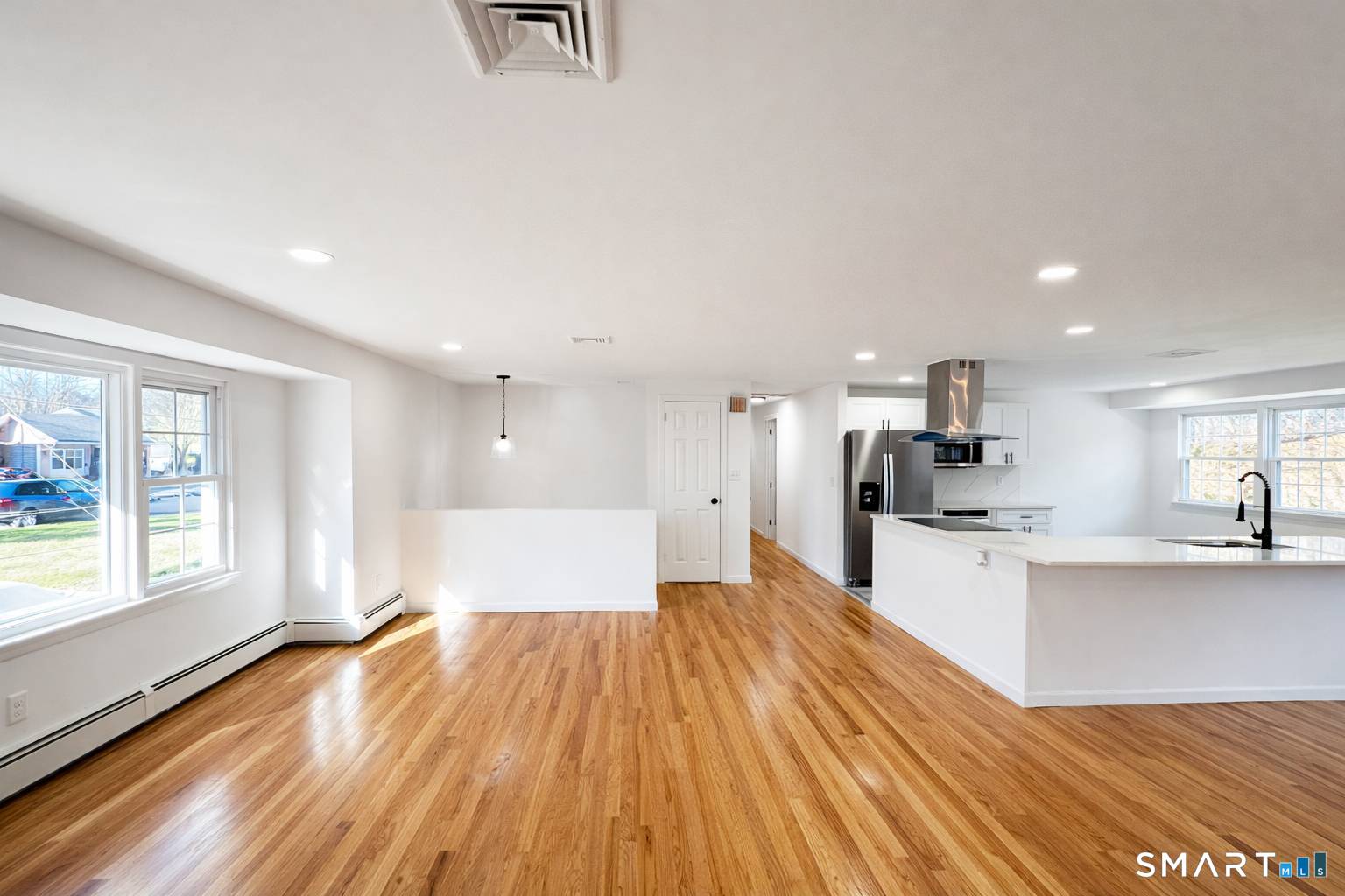 148 Hyde Road West Hartford, CT 06117 - Photo 4 of 24 a large kitchen with stainless steel appliances a large counter top a sink a refrigerator and a window
