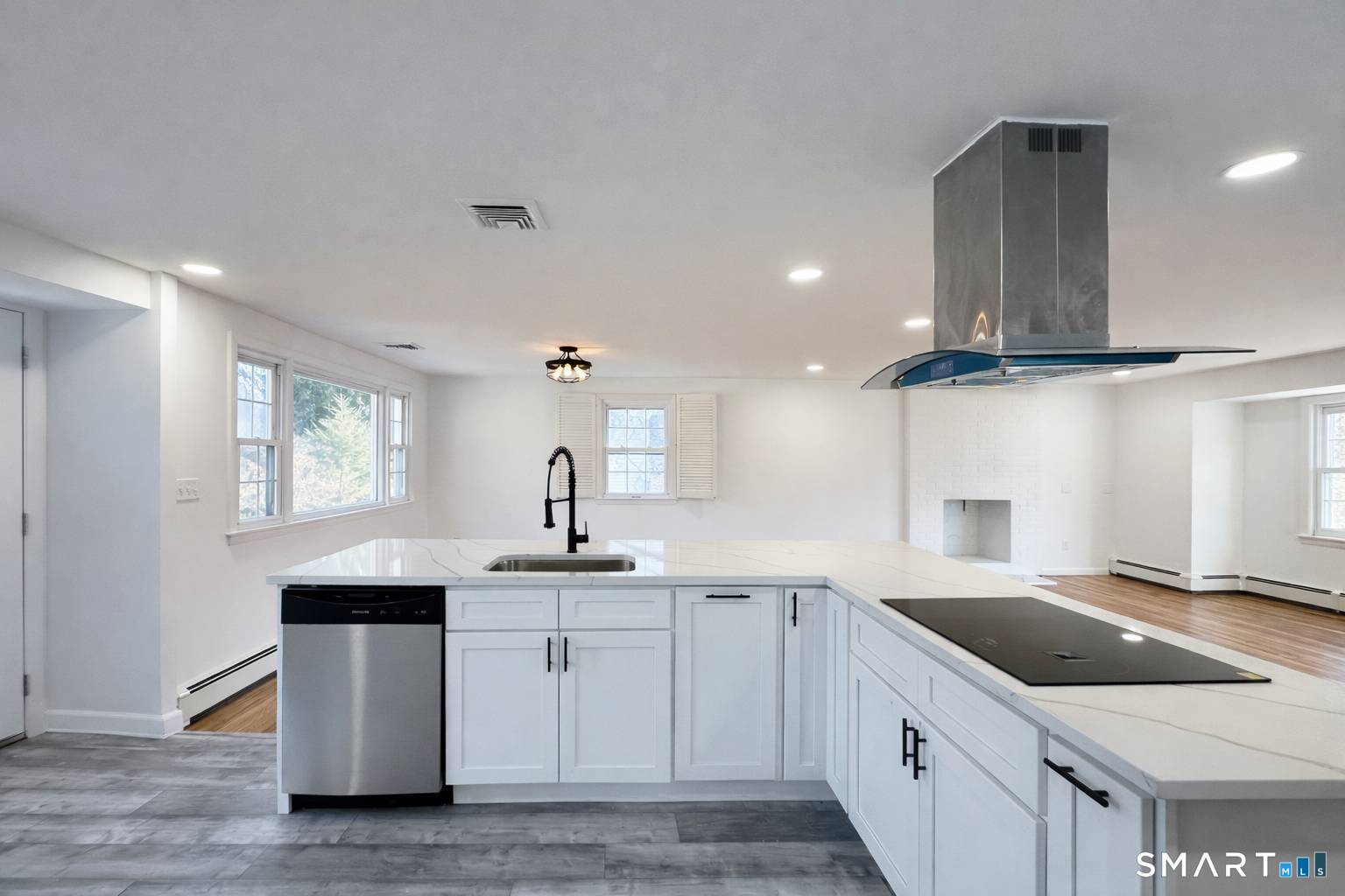 148 Hyde Road West Hartford, CT 06117 - Photo 10 of 24 a kitchen with a sink stove and cabinets