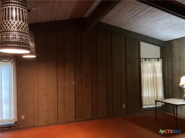 a view of yellow house with a outdoor space