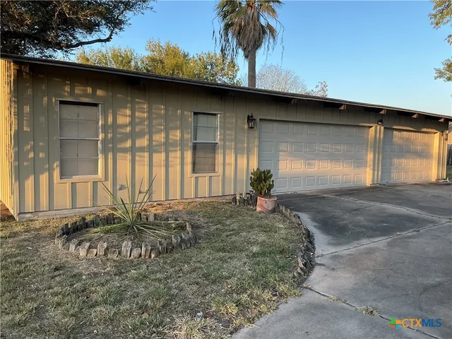 a living room with a furniture and a window