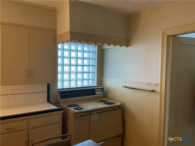a view of storage and utility room with washer and dryer