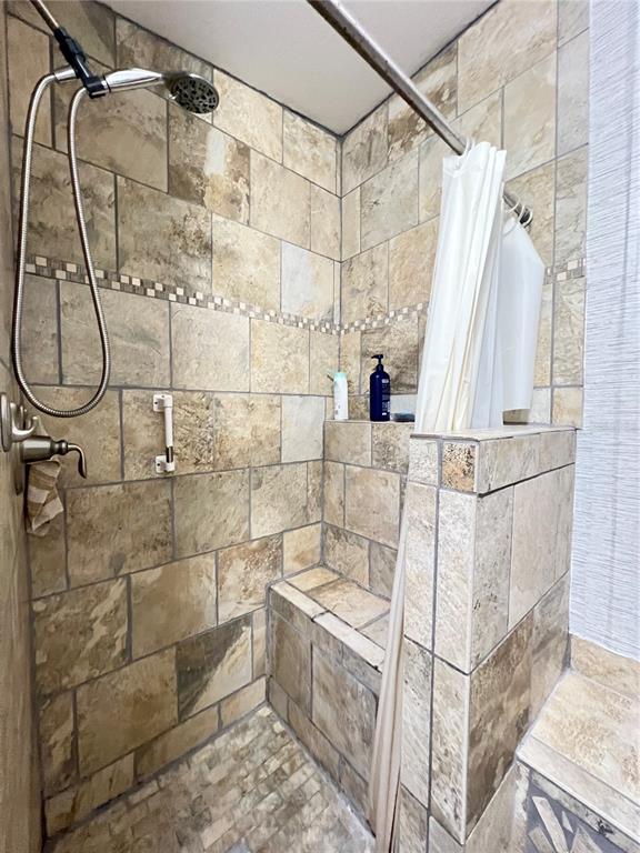 10100 Burnt Store Road, Unit 27 Punta Gorda, FL 33950 - Photo 22 of 37 a bathroom with a bathtub and shower