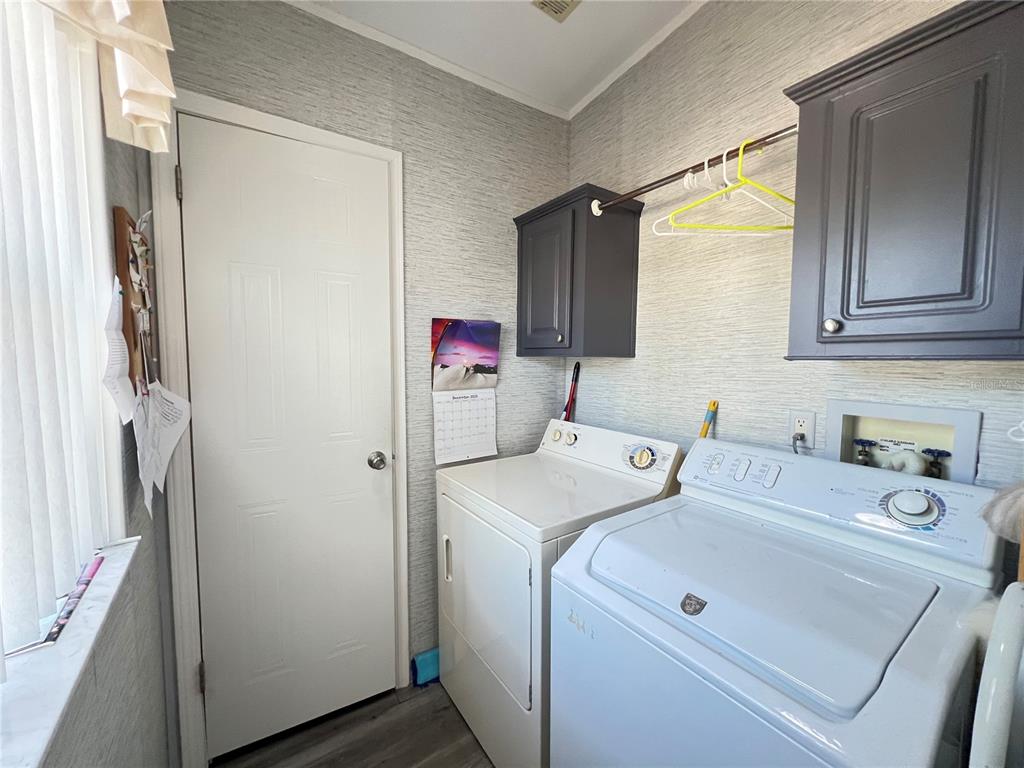 10100 Burnt Store Road, Unit 27 Punta Gorda, FL 33950 - Photo 31 of 37 a utility room with dryer and washer