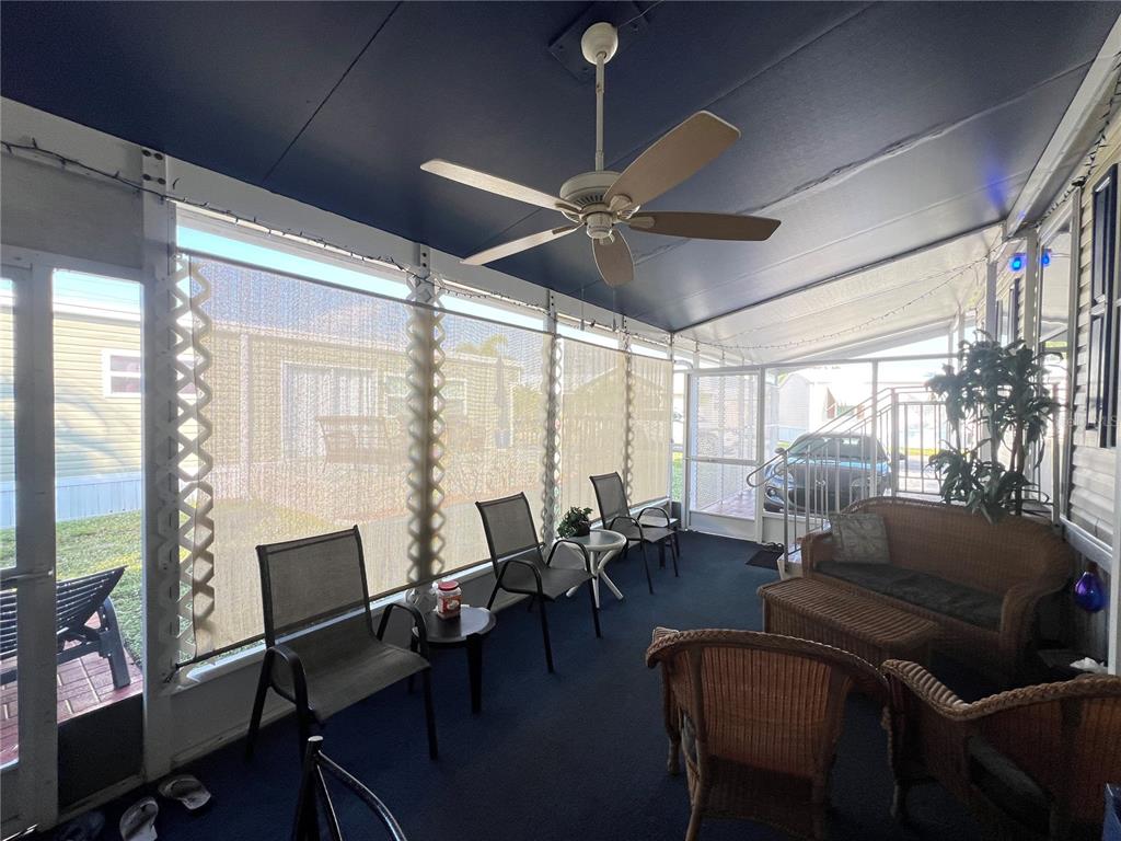 10100 Burnt Store Road, Unit 27 Punta Gorda, FL 33950 - Photo 34 of 37 a living room with furniture and a large window