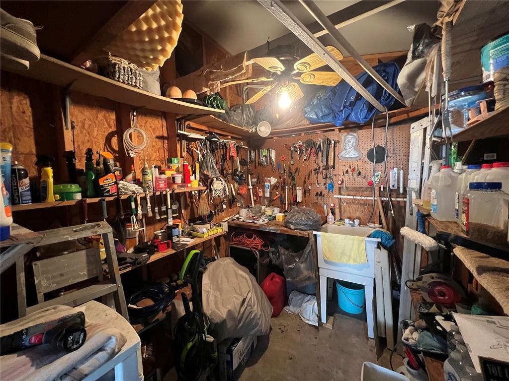 10100 Burnt Store Road, Unit 27 Punta Gorda, FL 33950 - Photo 35 of 37 a view of a storage room with washer and dryer