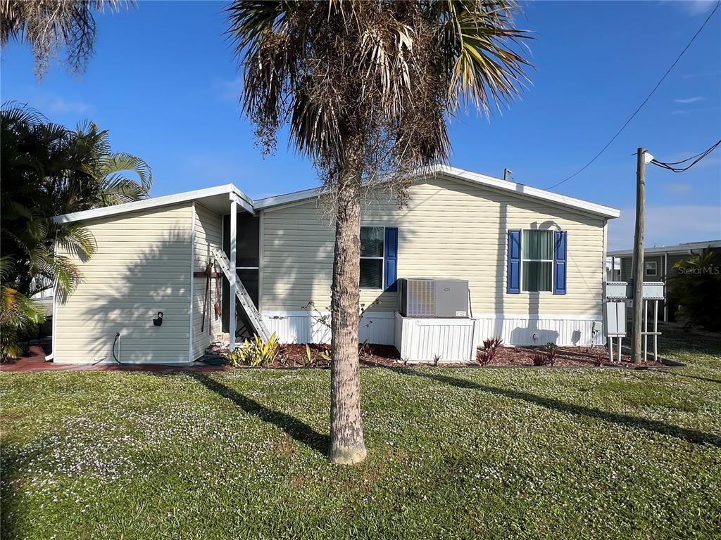10100 Burnt Store Road, Unit 27 Punta Gorda, FL 33950 - Photo 37 of 37 a house view with a backyard space