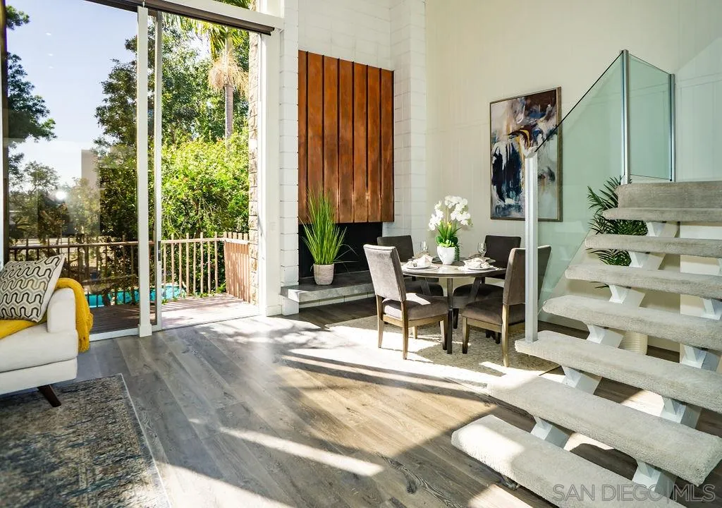 2630 Torrey Pines Road, Unit E22 La Jolla, CA 92037 - Photo 2 of 37 a view of a patio with a dining table and chairs