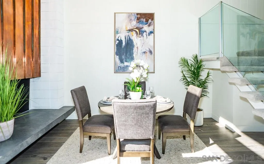 2630 Torrey Pines Road, Unit E22 La Jolla, CA 92037 - Photo 8 of 37 a view of a dining room with furniture and a potted plant
