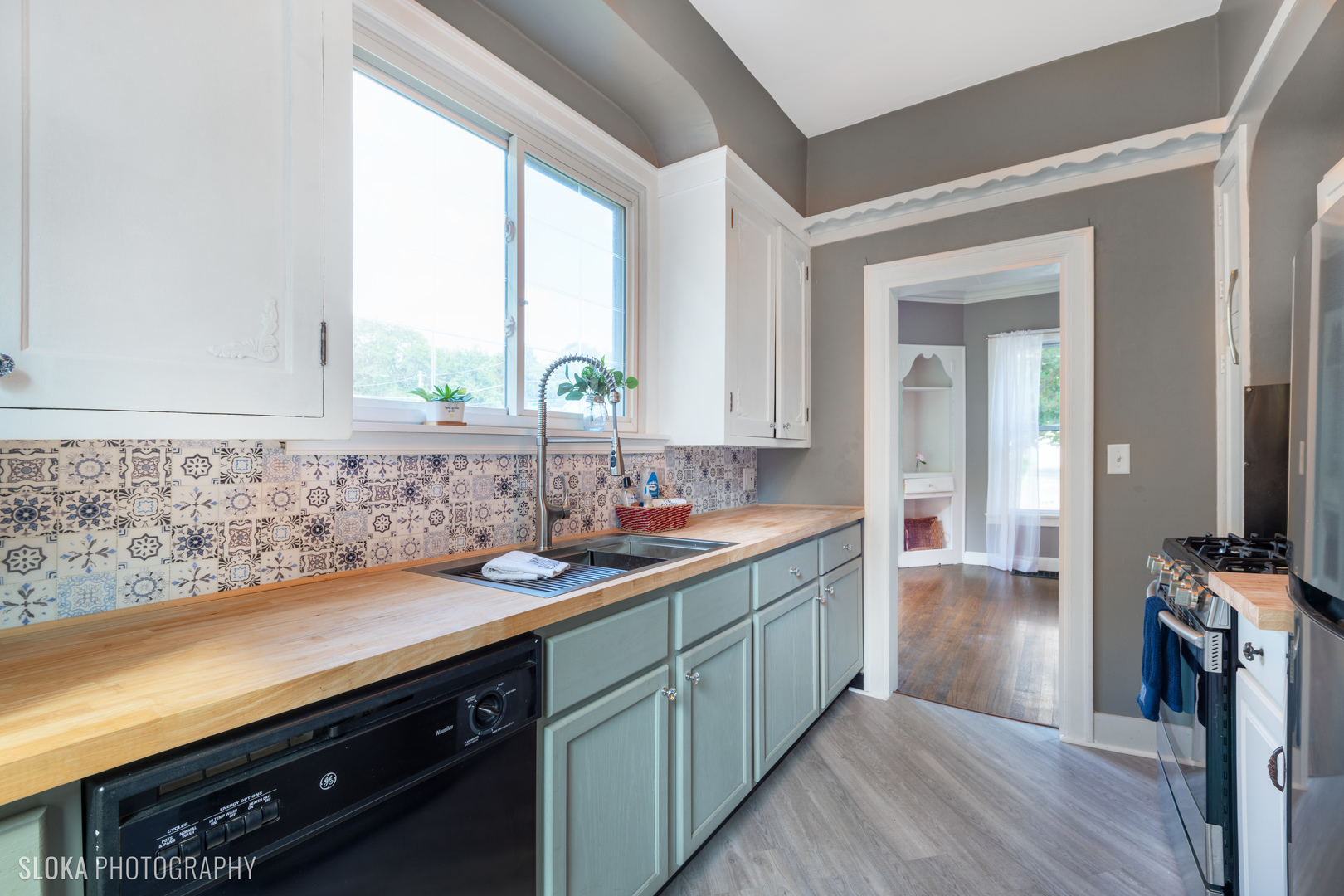 1044 Prospect Street Elgin, IL 60120 - Photo 13 of 21 a kitchen with a sink and cabinets