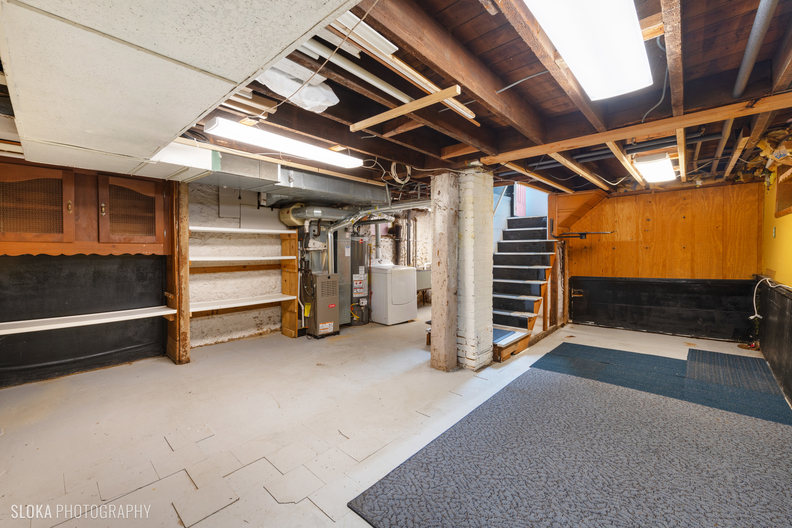 1044 Prospect Street Elgin, IL 60120 - Photo 16 of 21 a view of an empty room with a staircase