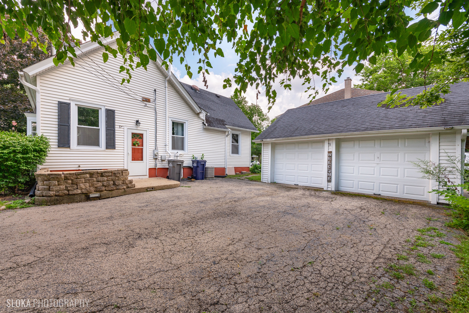 1044 Prospect Street Elgin, IL 60120 - Photo 18 of 21 a view of a house with a yard and garage