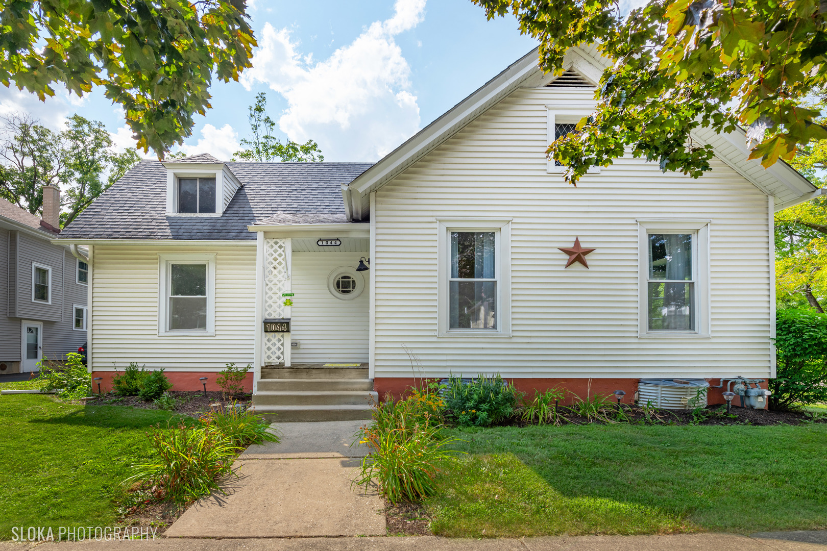 1044 Prospect Street Elgin, IL 60120 - Photo 3 of 21 a view of a house with a yard