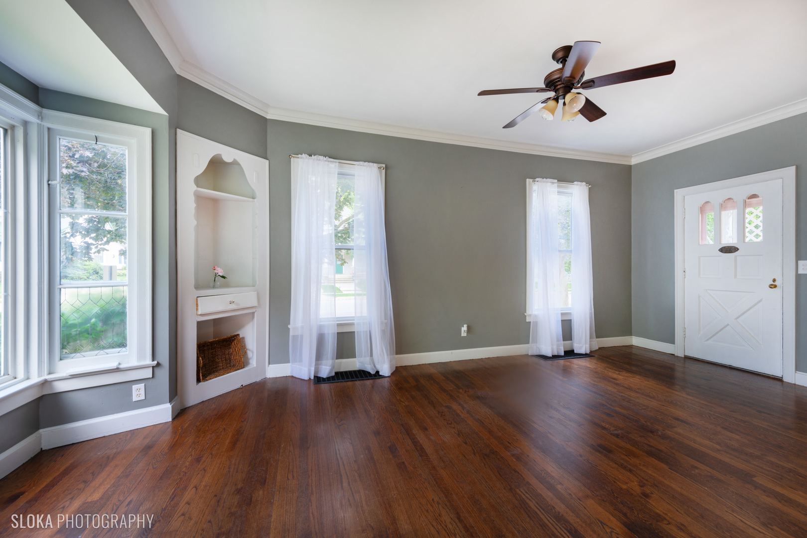 1044 Prospect Street Elgin, IL 60120 - Photo 6 of 21 a view of empty room with wooden floor and fan