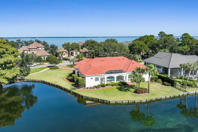 an aerial view of a house with a lake view
