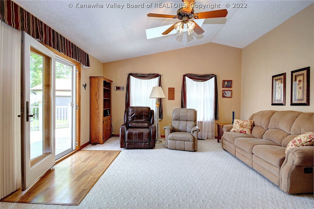 Cathedral ceiling family room with sky lights.
