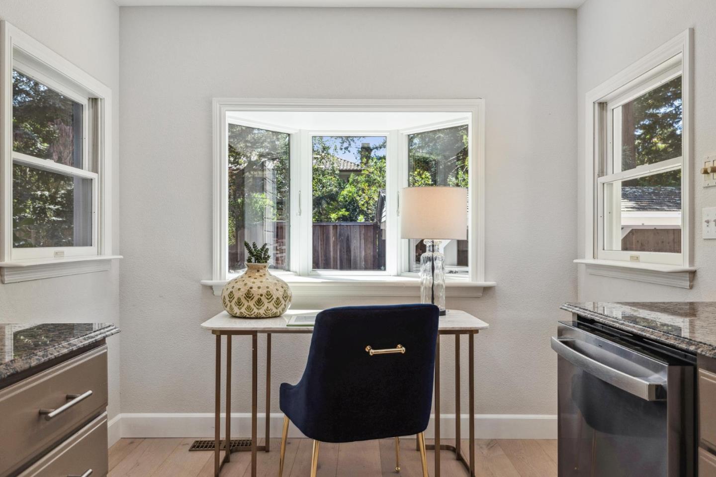961 Berkeley Avenue Menlo Park, CA 94025 - Photo 12 of 27 a table and chairs in a kitchen next to a window