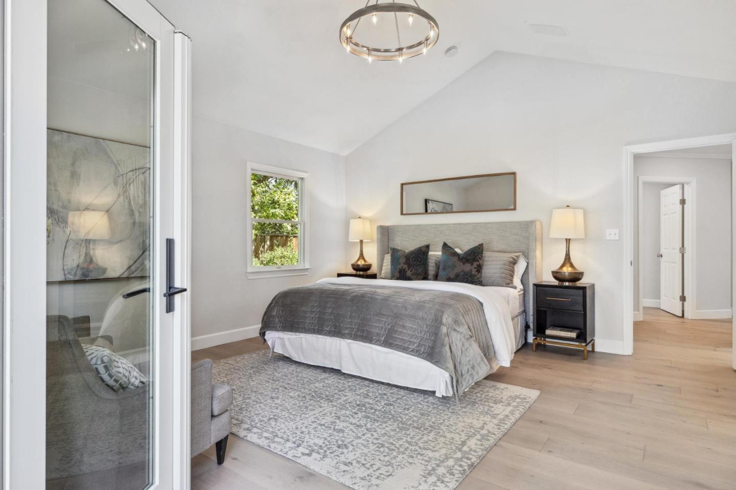 961 Berkeley Avenue Menlo Park, CA 94025 - Photo 13 of 27 a bedroom with a bed and a painting on the wall